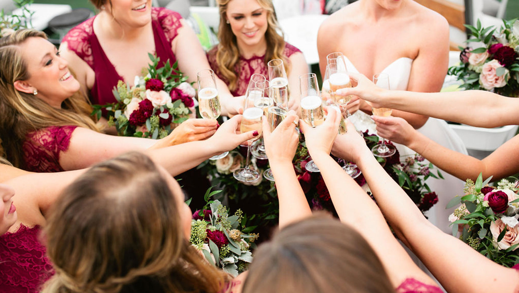 bride and bridesmaids cheers champagne at Kimpton Tryon Park Hotel