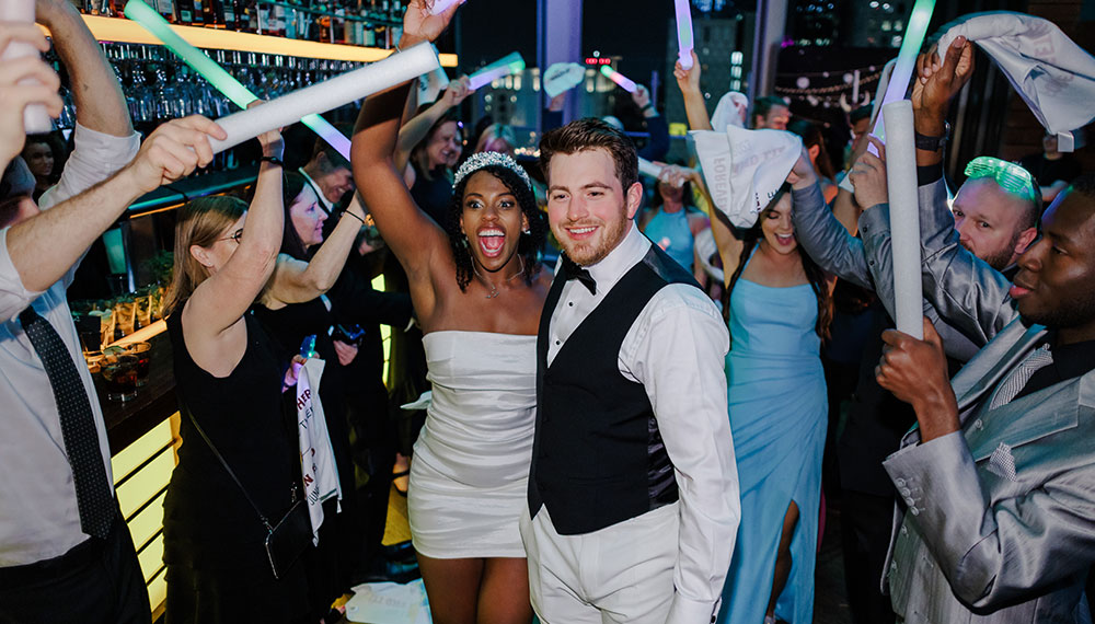 Liz and Mason celebrating with guests at the reception