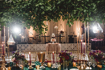 outdoor table setting with flowers and cake