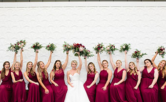 bride and bridesmaids holding up flower bouquets