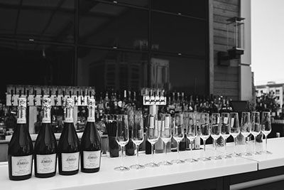 bar with bottles of champagne and glasses