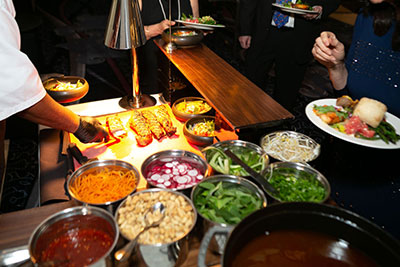 couple clinking champagne glasses as the wedding toasts are said.