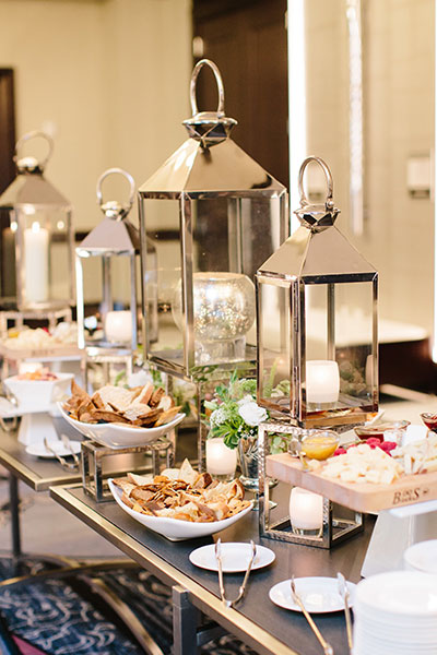 wedding reception table settingwith food and candles